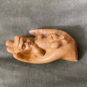 Baby Jesus cradled in palm of hand Handcrafted Wooden Figurine